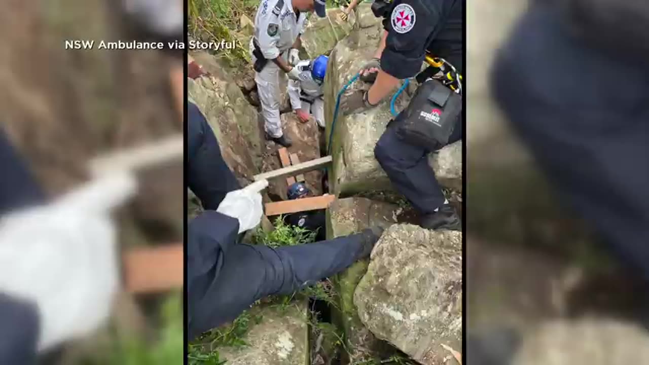 Woman gets stuck between boulders upside down for seven hours after dropping her phone