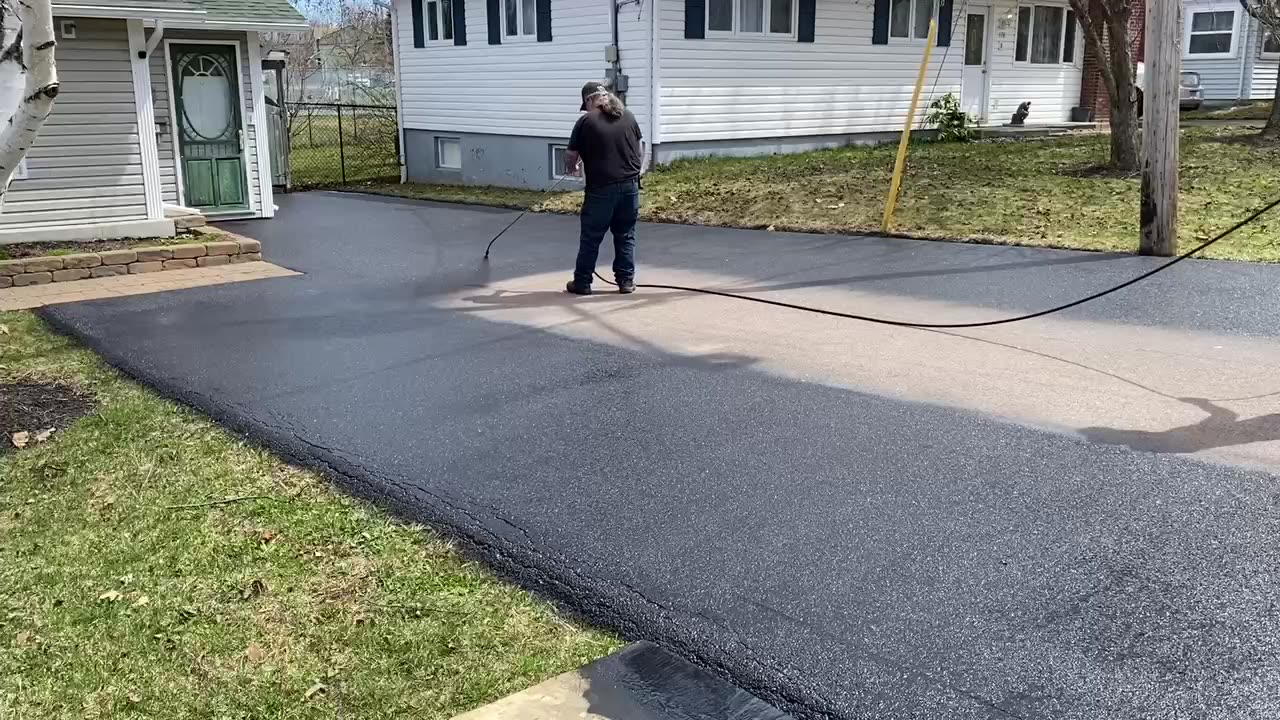 Professional Asphalt Spray Sealing: “The Curious Neighbour One” Top Coats Pavement Maintenance