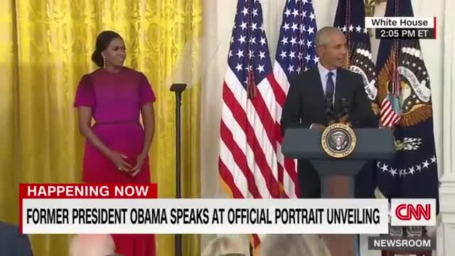 Barack Obama gives a speech after the unveiling of his White House portrait