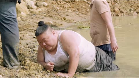 Nagaland minister Temjen Imna suffering in a muddy pond