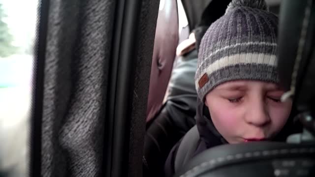 'We left our Dad in Kyiv' -little boy chokes back tears