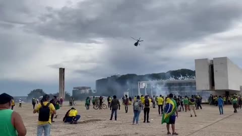 Police are now dropping tear gas from helicopters onto the Brazilian protesters.