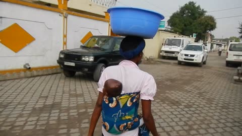 African woman carrying a baby, Peoples Republic of Congo