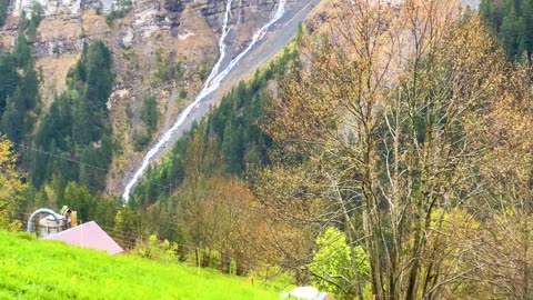Beautiful rain walking trip in the Swiss village of Gimmelwald