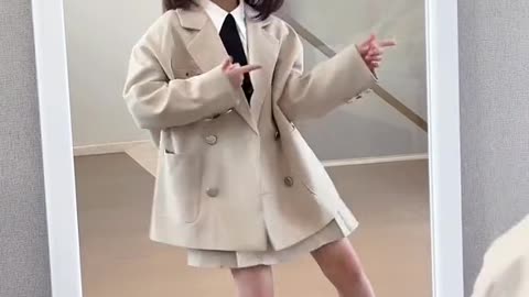 cute baby dancing in the mirror with cool suit