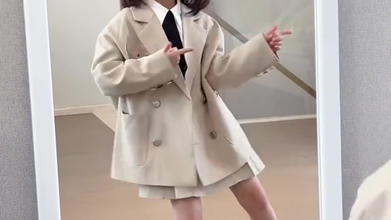 cute baby dancing in the mirror with cool suit