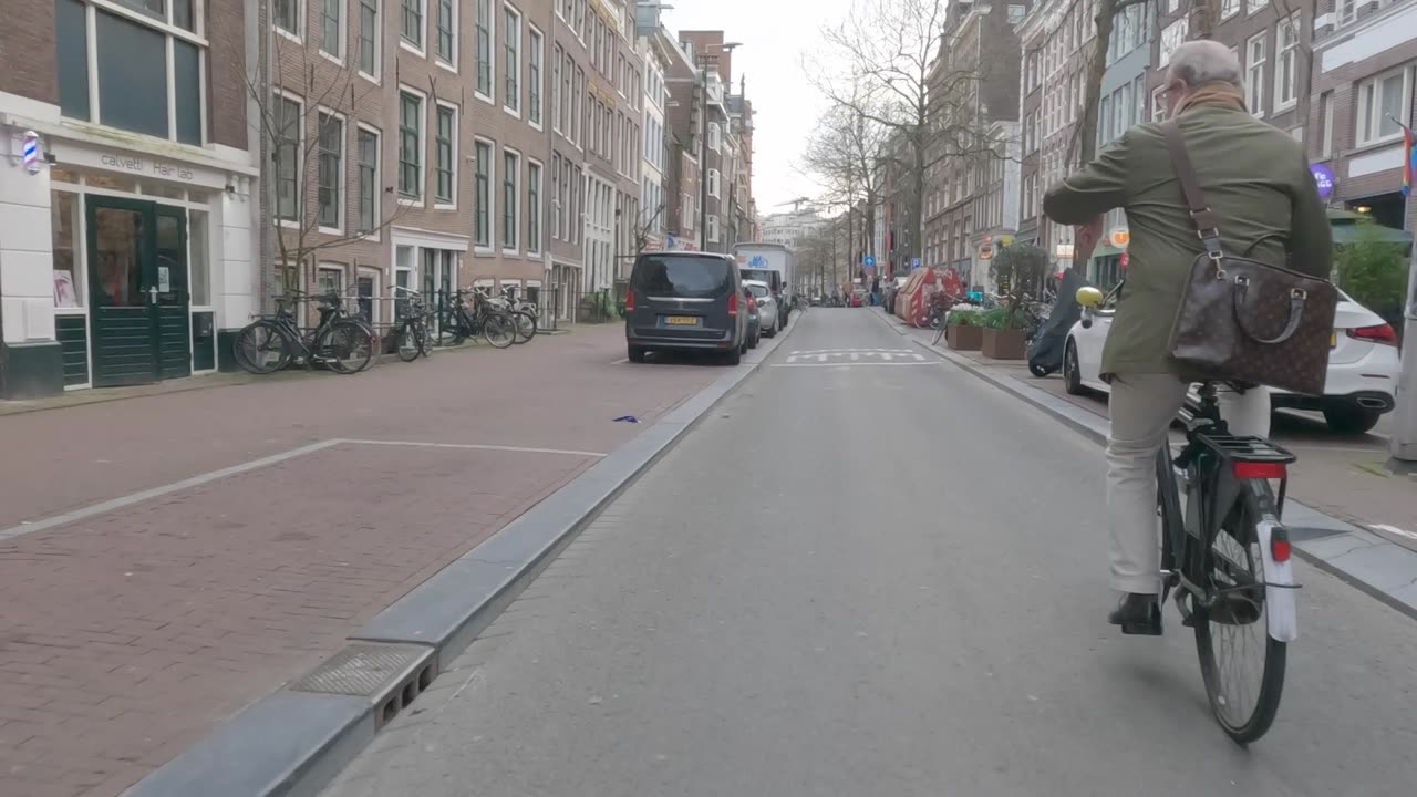 Amsterdam bike ride. City scenes, natural sounds and lots of bikes