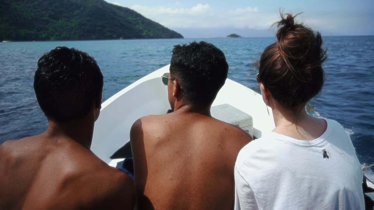 People Riding A Boat