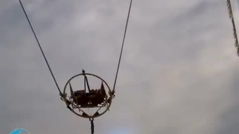 Slingshot ride snaps mid-air with riders inside