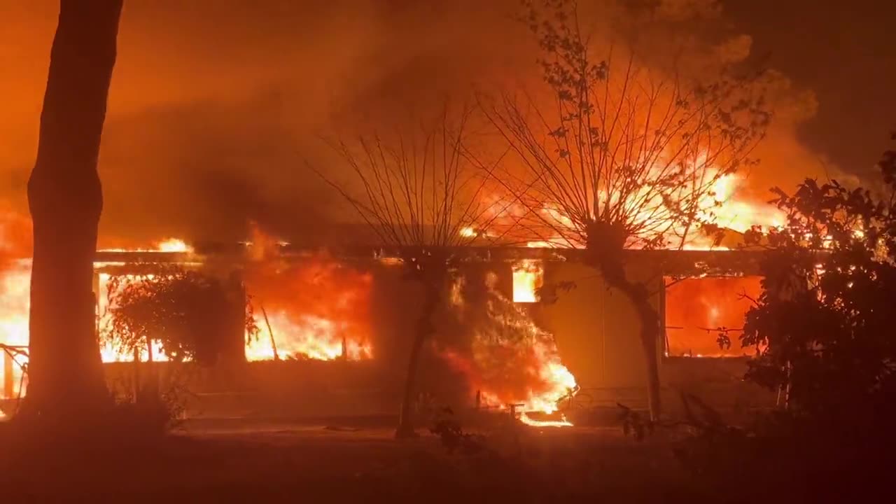 Wildfires torch structures in Riverside County, California. Thousands are evacuated.