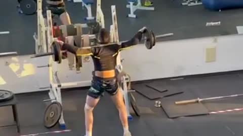 Guy Hilariously Leans Forward and Dips in Air While Lifting Barbell at Gym