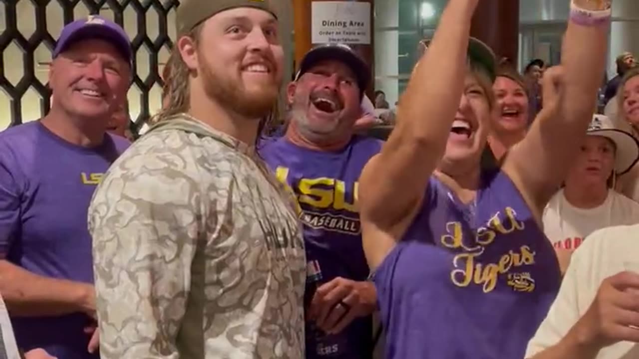 LSU's Tommy White comes down to greet his family right as the highlight of his home run hits