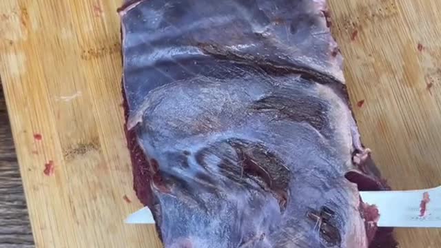 Cleaning up a bottom round roast from a deer