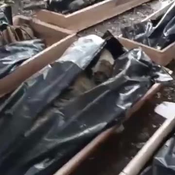 WAGNER FIGHTERS SHOW COFFINS WITH UKRAINIAN SOLDIERS IN BAKHMUT