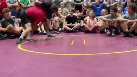 Wrestling Coach Takes On Students