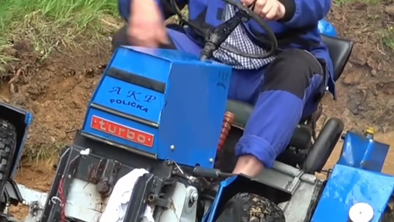 Men driving mini tractor 2025