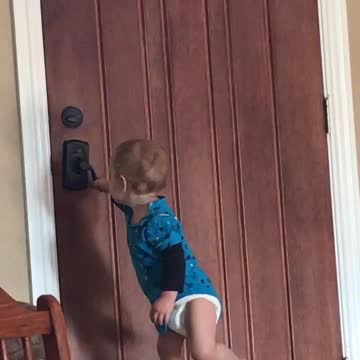 Baby trying to unlock door FUNNY!