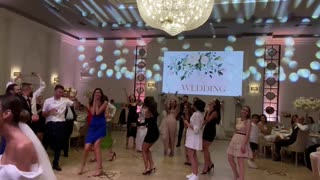 Bride's Bouquet Gets Stuck in Chandelier