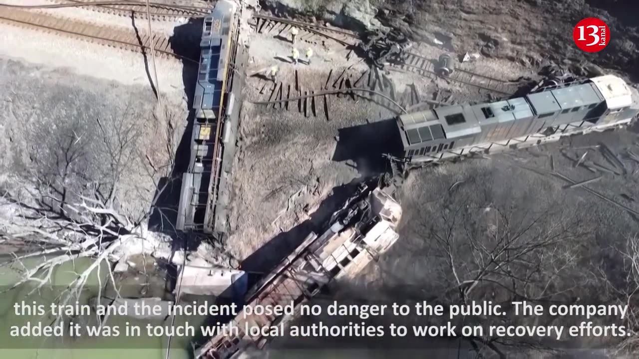 Drone video shows smoking wreckage of train that derailed near West Virginia river