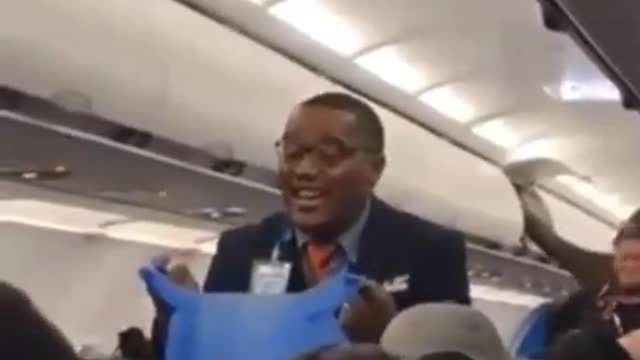 Flight Attendant Sings "Throw Away Your Masks"