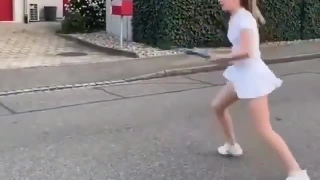 Girl practicing tennis Alone