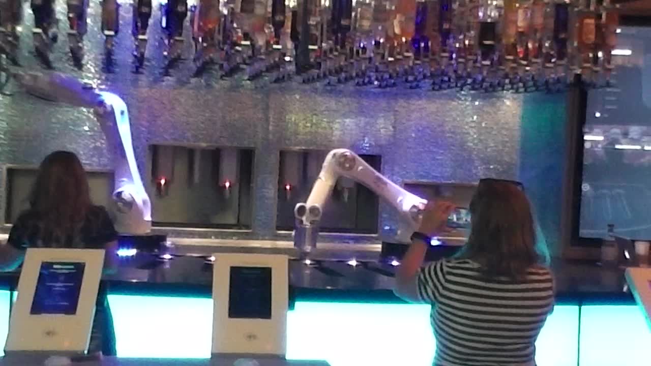 Robot bartenders in action.