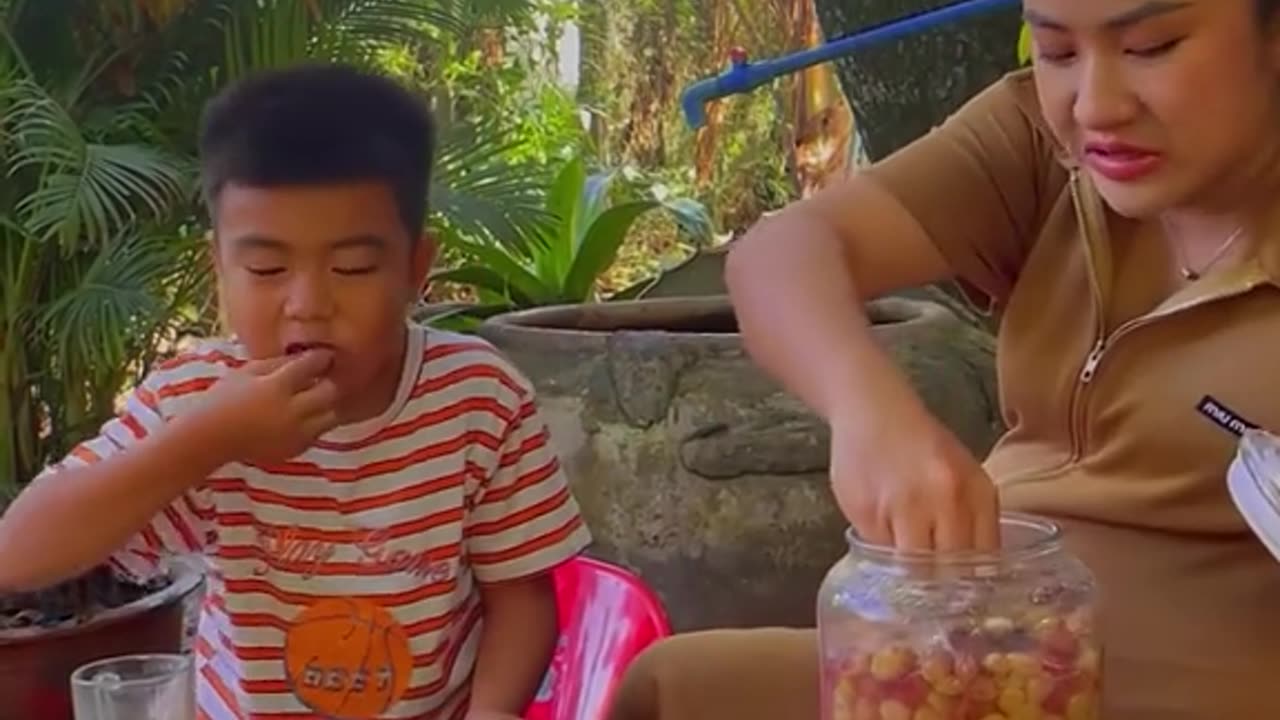 Little boy Chinese working to kitchen