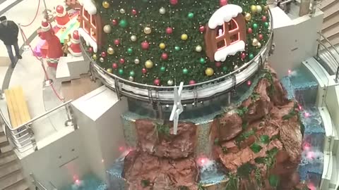 Christmas tree with a fountain in the shopping center continued