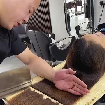 Chopping her hair in a weird way