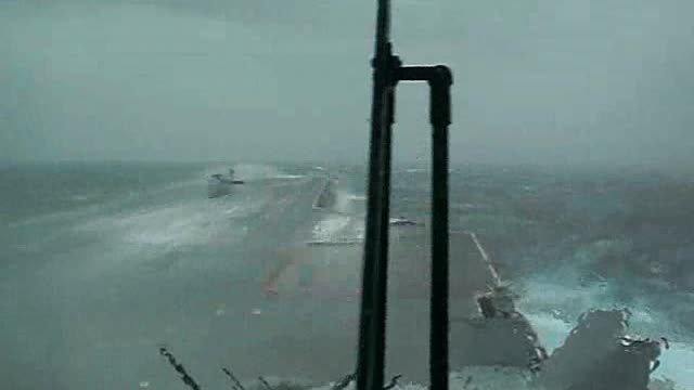 Massive Wave Over the Bow of an Aircraft Carrier