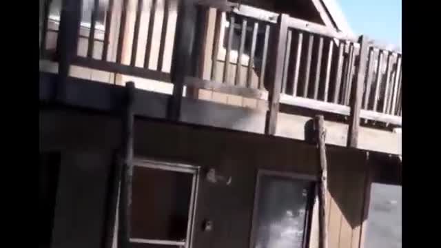 A house along the river in Alaska is washed away by floodwaters