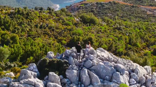 Drone Footage of People on Top of a Rocky Mountain
