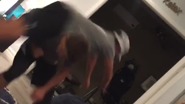 Guy with white hat tries to flip over friends back and falls on beanbag