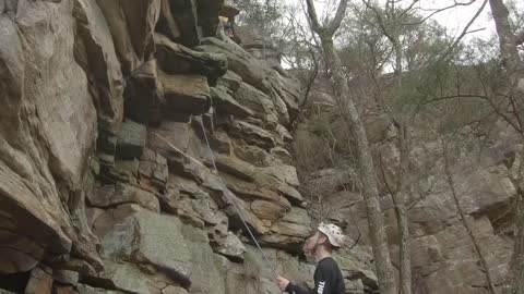 Climber, wearing a helmet, gets hit on the head with a rock- Funny Reaction!!