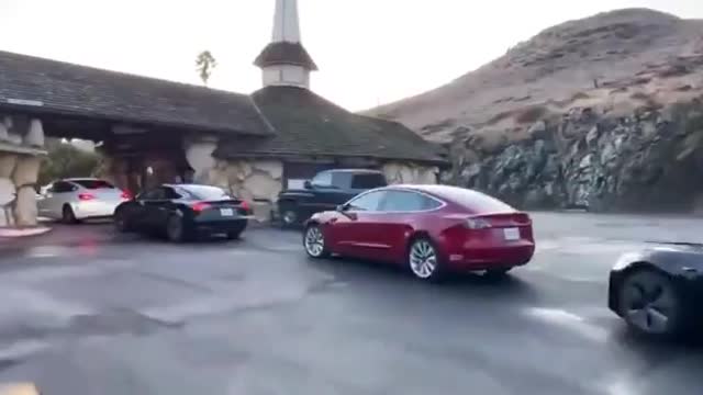 ⚠️Still want to buy an EV? Here's a Tesla charging line in California....