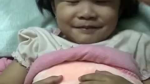 Baby pretends to sleep to ask for play