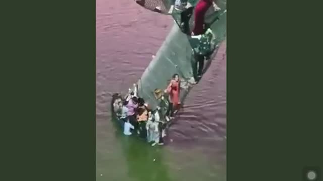 People are trapped on a suspended bridge that collapsed in Gujarat, India.