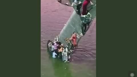 People are trapped on a suspended bridge that collapsed in Gujarat, India.