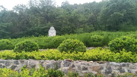 In the distance sits a Guanyin