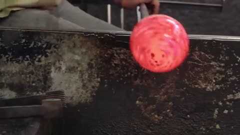 Blow up the fused glass and roll it around