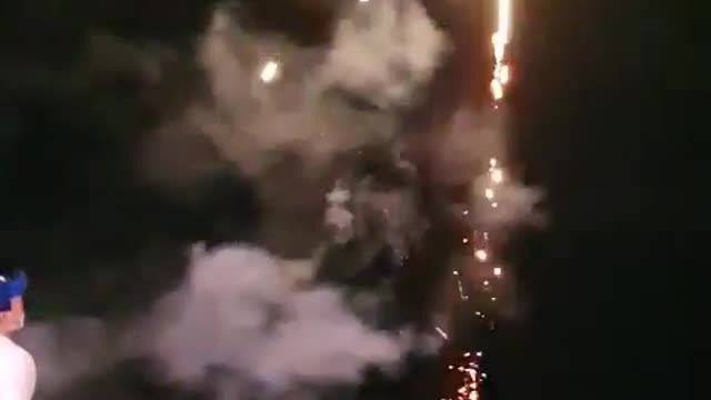 Small fireworks display in the night sea