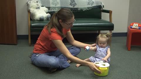 Mom playing with her baby girl.