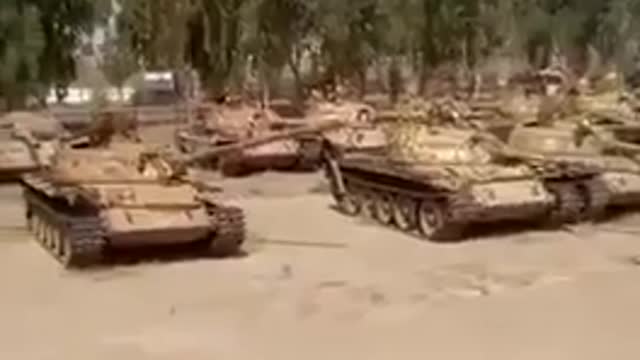 Taliban showing a large yard full of American tanks