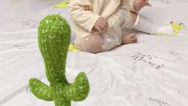 What a funny baby with funny toy