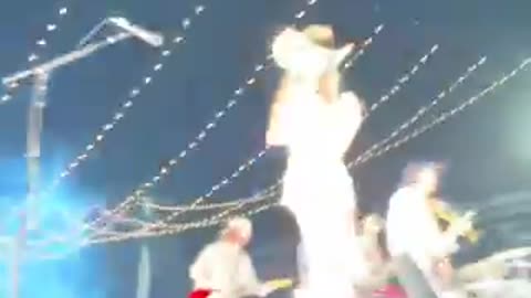 'Hawk Tuah' Girl stuns crowd at Zach Bryan show, sparking frenzy among fans. 🎤🌟