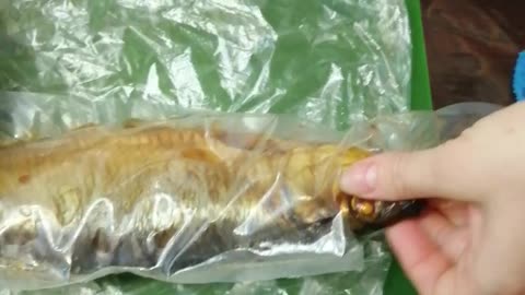 Cooking a delicious herring for lunch.