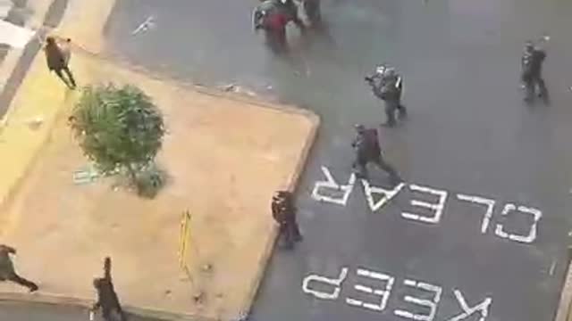 Aerial View Of Riot Police Shooting Rubber Bullets At Construction Workers In Melbourne