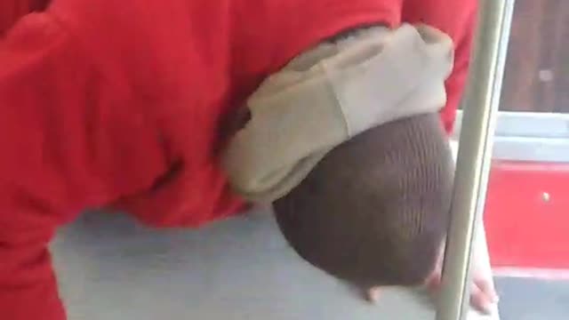 Guy does mini push ups on subway floor