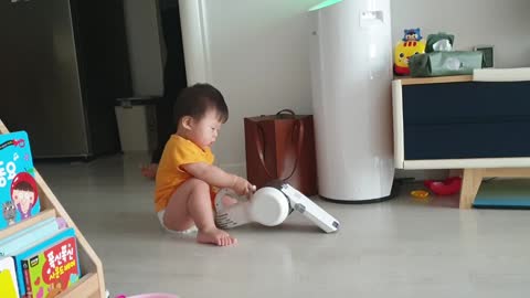 A cute kid whose hobby is cleaning.