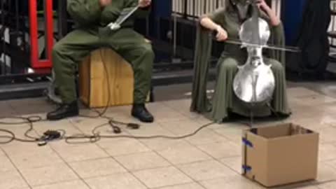 Metal elephant guy musician subway